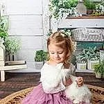 Face, Plant, Photograph, Dress, White, Flowerpot, Blue, Happy, Baby & Toddler Clothing, Pink, Grass, Toddler, Embellishment, Bridal Clothing, Gown, Child, Formal Wear, Petal, Magenta, Person, Joy