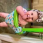 Smile, Green, Baby & Toddler Clothing, Pink, Leisure, Toddler, Wood, Baby, Fun, Thigh, Happy, Child, Recreation, Human Leg, Sitting, Play, Sandal, Vacation, Baby Products, Outdoor Furniture, Person, Joy, Headwear