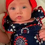 Face, Nose, Cheek, Skin, Head, Lip, Outerwear, Hairstyle, Eyes, Shoulder, Facial Expression, Dress, Plant, Neck, Baby & Toddler Clothing, Human Body, Textile, Sleeve, Person, Headwear