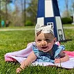Face, Smile, Plant, People In Nature, Happy, Baby, Grass, Leisure, Baby & Toddler Clothing, Fun, Toddler, Summer, Grassland, Meadow, Lawn, Child, Tree, Hat, Recreation, Sitting, Person, Joy, Headwear
