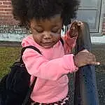 Hair, Nose, Head, Sleeve, Standing, Pink, Baby & Toddler Clothing, Toddler, Happy, Grass, Child, Thumb, Pattern, Fun, Magenta, Afro, Baby, Brickwork, Companion dog, Luggage And Bags, Person