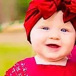 Hair, Face, Skin, Head, Lip, Smile, Outerwear, Eyes, Photograph, Hat, Human Body, Happy, Dress, Pink, Baby, Headgear, Baby & Toddler Clothing, Toddler, Red, Magenta, Person, Headwear