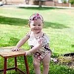 Skin, Plant, Smile, Shorts, Leg, People In Nature, Leaf, Dress, Grass, Happy, Hat, Table, Outdoor Furniture, Baby & Toddler Clothing, Leisure, Baby, Toddler, Child, Morning, Summer, Person, Joy, Headwear