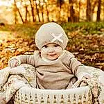 Smile, Photograph, People In Nature, Plant, Flash Photography, Tree, Happy, Grass, Baby, Toddler, Wood, Baby & Toddler Clothing, Sitting, Child, Black & White, Cap, Winter, Deciduous, Portrait Photography, Monochrome, Person, Joy, Headwear