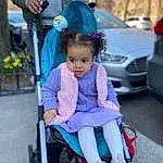 Tire, Vehicle, Wheel, Blue, Car, Street Fashion, Happy, Recreation, Leisure, Toddler, Vehicle Door, Fun, Sneakers, Electric Blue, Baby Carriage, Personal Luxury Car, Child, Automotive Design, Vroom Vroom, Magenta, Person