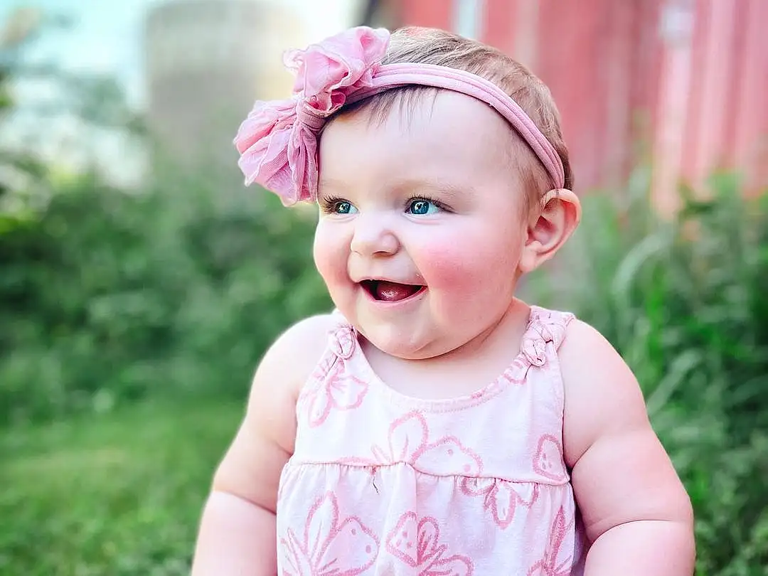 Skin, Smile, Plant, Baby & Toddler Clothing, Happy, Standing, Sky, Pink, Flash Photography, Grass, Toddler, Baby, Magenta, Child, Fun, Pattern, Fashion Accessory, Sitting, People In Nature, Headband, Person, Joy