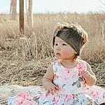 Skin, Sky, White, Dress, Flash Photography, Sleeve, Baby & Toddler Clothing, Pink, Grass, Happy, Toddler, Child, Pattern, Fun, Baby, Grassland, Magenta, Sitting, Fashion Accessory, Person, Headwear
