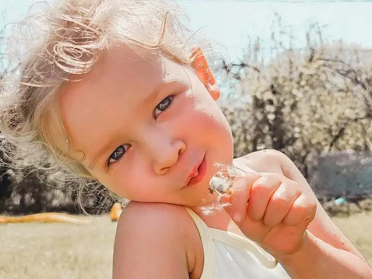 Skin, Head, Lip, Eyes, Smile, Flash Photography, Happy, Sky, Gesture, Grass, Toddler, People In Nature, Fun, Blond, Child, Brown Hair, Fashion Accessory, Sand, Headpiece, Vacation, Person