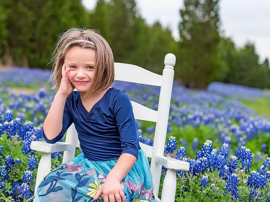 Plant, Smile, Flower, People In Nature, Blue, Nature, Tree, Botany, Happy, Grass, Sunlight, Sky, Summer, Toddler, Meadow, Grassland, Electric Blue, Leisure, Recreation, Child, Person, Joy