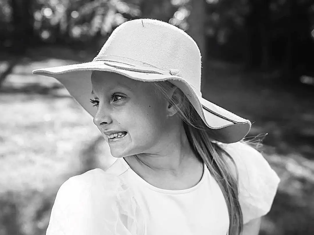 Shoulder, White, Black, Smile, Plant, Flash Photography, People In Nature, Sleeve, Happy, Cap, Black-and-white, Hat, Sunlight, Style, Headgear, Grass, Monochrome, Black & White, Toddler, T-shirt, Person, Joy, Headwear