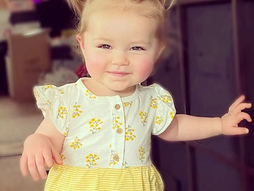 Clothing, Hair, Face, Cheek, Skin, Head, Photograph, Baby & Toddler Clothing, Neck, Dress, Human Body, Smile, Yellow, Sleeve, One-piece Garment, Happy, Iris, Pink, Toddler, Baby, Person, Joy