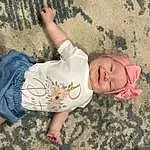 Skin, Head, Hand, Hairstyle, Eyes, Leg, Leaf, Human Body, Textile, Plant, Baby & Toddler Clothing, Wood, Finger, Comfort, Grass, Fawn, People In Nature, Thigh, Toddler, Fun, Person, Joy, Headwear