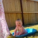 Smile, People In Nature, Green, Baby & Toddler Clothing, Grass, Fence, Toddler, Wood, Leisure, Happy, Fun, Baby, Lawn, Child, Recreation, Sitting, Play, Garden, Baby Products, Person
