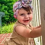 Clothing, Face, Smile, Eyes, Facial Expression, Green, Human Body, Plant, Pink, Happy, Baby & Toddler Clothing, Toddler, Leisure, Fun, Grass, Summer, Recreation, Wood, Cap, Headpiece, Person, Joy, Headwear