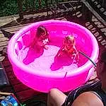 Water, Purple, Pink, Leisure, Fun, Red, Thigh, Carnivore, Bathing, Magenta, Recreation, Swimwear, Toddler, Human Leg, Swimming Pool, Underpants, Knee, Personal Protective Equipment, Spandex, Vacation, Person