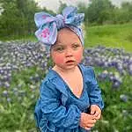 Head, Flower, Plant, Outerwear, Eyes, Purple, People In Nature, Botany, Azure, Blue, Grass, Happy, Baby & Toddler Clothing, Tree, Baby, Petal, Summer, Toddler, Meadow, Grassland, Person, Headwear