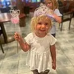 Skin, Smile, Head, Dress, Happy, Gesture, Pink, Toddler, Fun, Child, Headpiece, Event, Blond, Jewellery, Tiara, Fashion Accessory, Entertainment, Party Supply, Party, Person, Joy