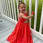Smile, Arm, Shoulder, Dress, One-piece Garment, Green, Textile, Sleeve, Baby & Toddler Clothing, Waist, Happy, Pink, Day Dress, Bridal Party Dress, Fence, Sleeveless Shirt, Toddler, Formal Wear, Gown, Magenta, Person, Joy