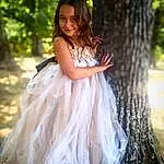Face, Hair, Head, Smile, Hand, Plant, Arm, Eyes, Dress, Leg, Tree, Bridal Clothing, People In Nature, Human Body, Flash Photography, Bridal Party Dress, Happy, Grass, Gown, Wood, Person, Joy
