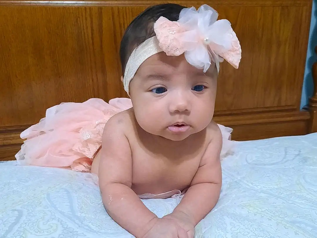 Cheek, Chin, Baby & Toddler Clothing, Iris, Baby, Pink, Headgear, Toddler, Headpiece, Headband, Wood, Linens, Hair Accessory, Fashion Accessory, Flower, Sitting, Child, Baby Products, Cap, Baby Sleeping, Person, Headwear