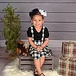 Smile, Hairstyle, Tartan, Leg, Sleeve, Standing, Baby & Toddler Clothing, Plaid, Flash Photography, Happy, Toddler, Plant, Beauty, Pattern, Flowerpot, Human Leg, Thigh, Wood, Knee, Fashion Accessory, Person, Joy