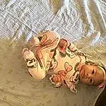 Textile, Wood, Comfort, Baby & Toddler Clothing, Happy, Baby, Art, Toddler, Linens, Pattern, Doll, Foot, Baby Sleeping, Stuffed Toy, Human Leg, Child, Peach, Baby Products, Room, Person