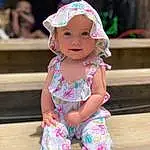 Face, Head, Skin, Smile, Photograph, Eyes, Baby & Toddler Clothing, Sleeve, Happy, Pink, Toddler, Headgear, Child, Leisure, Baby, Beauty, Magenta, Thigh, Grass, Fun, Person, Headwear