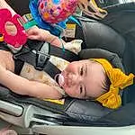 Hand, Arm, Car, Wheel, Vroom Vroom, Vehicle, Human Body, Automotive Design, Baby Carriage, Yellow, Gesture, Comfort, Finger, Vehicle Door, Baby, Seat Belt, Car Seat, Toddler, Child, Person
