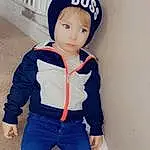 Clothing, Face, Shoe, Outerwear, White, Blue, Sleeve, Standing, Waist, Baby & Toddler Clothing, Headgear, Street Fashion, Cool, Denim, Cap, Blazer, Electric Blue, Child, Personal Protective Equipment, T-shirt, Person