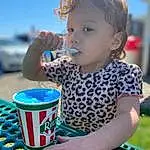 Photograph, Green, Blue, Drinkware, Happy, Baby Playing With Toys, Sky, Finger, Toddler, Public Space, Leisure, Summer, Fun, Baby & Toddler Clothing, Child, Recreation, Drink, T-shirt, Electric Blue, Play, Person