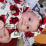 Cheek, Skin, Lip, Hand, Arm, Eyes, Mouth, Flower, Baby, Toy, Pink, Baby & Toddler Clothing, Toddler, Happy, Petal, Plant, Rose, Child, Event, Person