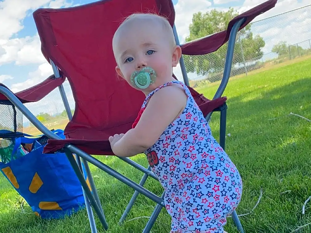 Cloud, Sky, Blue, People In Nature, Chair, Grass, Plant, Toddler, Leisure, Happy, Baby & Toddler Clothing, Recreation, Grassland, Electric Blue, Child, Outdoor Furniture, Comfort, Sitting, Event, Person