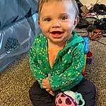 Face, Head, Smile, Eyes, Facial Expression, Toy, Football, Grass, Happy, Toddler, People, Ball, Baby & Toddler Clothing, Child, Fun, Baby, Leisure, Soccer Ball, Personal Protective Equipment, Person, Joy