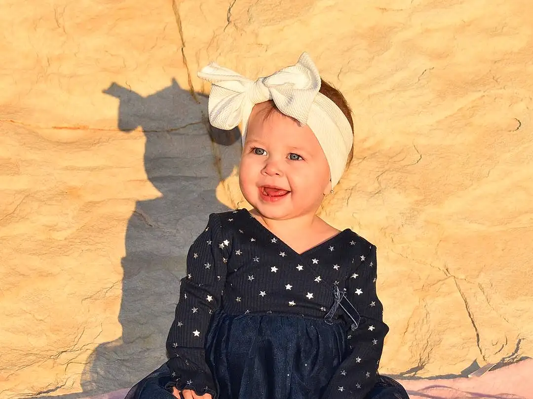 Photograph, Smile, Sleeve, Happy, Baby & Toddler Clothing, Headgear, Toddler, Tints And Shades, Fun, People In Nature, Flash Photography, Child, Fashion Accessory, Pattern, Landscape, Vintage Clothing, Shadow, Sitting, Art, Embellishment, Person, Headwear