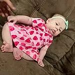 Clothing, Skin, Head, Comfort, Leg, Baby & Toddler Clothing, Human Body, Sleeve, Gesture, Baby, Wood, Pink, Thigh, Toddler, Grass, Knee, Plaid, Linens, Foot, Child, Person