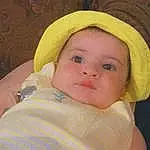 Nose, Face, Cheek, Skin, Lip, Chin, Eyebrow, Eyes, Baby, Baby & Toddler Clothing, Iris, Sleeve, Smile, Headgear, Toddler, Cap, Hat, Sun Hat, Happy, Fashion Accessory, Person