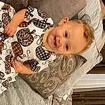 Smile, Hairstyle, Facial Expression, Textile, Sleeve, Wood, Happy, Comfort, Toddler, Baby, Tree, Pattern, Baby & Toddler Clothing, Design, Linens, Child, Room, Sitting, Visual Arts, Person, Joy