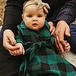 Skin, Baby & Toddler Clothing, Textile, Sleeve, Gesture, Grass, Toddler, Baby, Happy, Pattern, Wool, Sitting, Fashion Accessory, Wrist, Plaid, Baby Products, Thumb, Child, Furry friends, Jewellery, Person