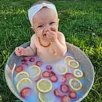 Facial Expression, Smile, Leaf, People In Nature, Happy, Plant, Baby & Toddler Clothing, Grass, Baby, Leisure, Toddler, Fun, Child, Liquid Bubble, Fruit, Recreation, Pattern, Tableware, Hat, Person