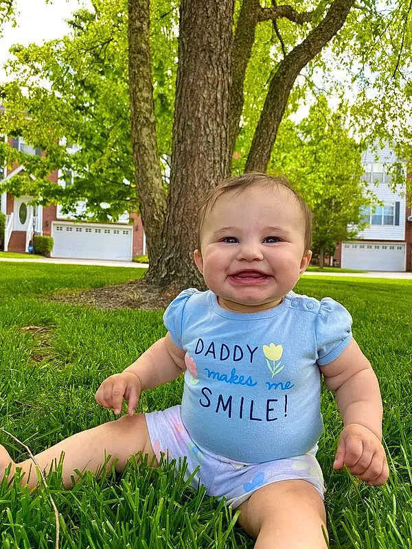 Skin, Plant, Smile, Eyes, People In Nature, Green, Leaf, Tree, Baby & Toddler Clothing, Yellow, Happy, Window, Baby, Sunlight, Grass, Leisure, Toddler, Summer, T-shirt, Fun, Person, Joy