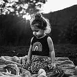 Hairstyle, Photograph, Flash Photography, Black-and-white, Happy, People In Nature, Sunlight, Style, Grass, Plant, Wood, Monochrome, Black & White, Toddler, Beauty, Landscape, Sitting, Person