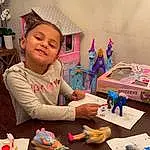 Smile, Table, Toy, Fun, Child, Toddler, Play-doh, Art, Event, Artist, Happy, Chair, Play, Leisure, Visual Arts, Plastic, Kindergarten, Recreation, Room, Person, Joy