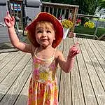 Smile, Happy, Pink, Wood, Leisure, Toddler, Magenta, Baby & Toddler Clothing, Fun, Hat, Child, Recreation, Thigh, Tree, Hardwood, Sandal, Play, Vacation, Baby, Pattern, Person