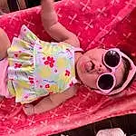 Face, Skin, Head, Smile, Textile, Happy, Pink, Sunglasses, Baby & Toddler Clothing, Thigh, Magenta, Fun, Child, Human Leg, Pattern, Comfort, Event, Sweetness, Toy, Wrist, Person