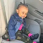 Comfort, Automotive Design, Sleeve, Smile, Car Seat Cover, Vroom Vroom, Vehicle Door, Car Seat, Head Restraint, Jacket, Toddler, Auto Part, Air Travel, Automotive Exterior, Child, Thigh, Sitting, Airline, Human Leg, Family Car, Person, Joy