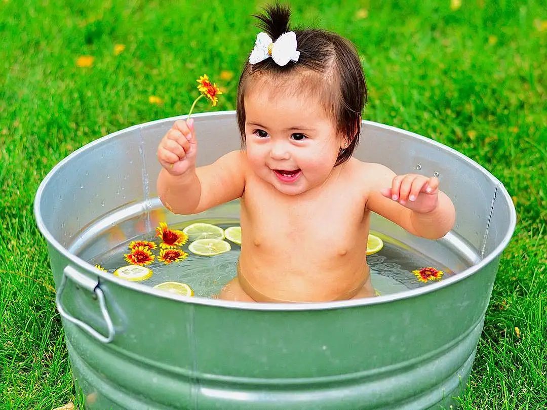 Baby Bathing, Water, Flower, Plant, Smile, Green, Bathtub, Fluid, People In Nature, Baby, Happy, Bathing, Grass, Toddler, Summer, Leisure, Fun, Child, Recreation, Baby Products, Person