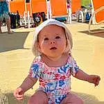 Skin, Sleeve, Baby & Toddler Clothing, Pink, Toddler, Fun, Summer, Leisure, Happy, Beauty, Barefoot, Child, Sand, Human Leg, Foot, Chair, T-shirt, Recreation, Play, Person, Headwear, Blurred