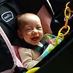 Cheek, Facial Expression, Baby Carriage, Smile, Baby, Comfort, Happy, Toddler, Automotive Design, Car Seat, Child, Fun, Auto Part, Baby Products, Baby & Toddler Clothing, Baby In Car Seat, Vroom Vroom, Sitting, Steering Wheel, Grass, Person
