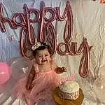 Dress, Tableware, Pink, Decoration, Happy, Toddler, Headpiece, Serveware, Balloon, Cake Decorating, Sugar Cake, Party Supply, Event, Sweetness, Table, Icing, Cake Decorating Supply, Happy Birthday!, Drinkware, Curtain, Person