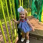 Smile, Photograph, Green, Botany, Leaf, Nature, Yellow, Baby & Toddler Clothing, Plant, Leisure, Grass, Line, Toddler, Fun, Fence, Playground, Baby, Recreation, Person